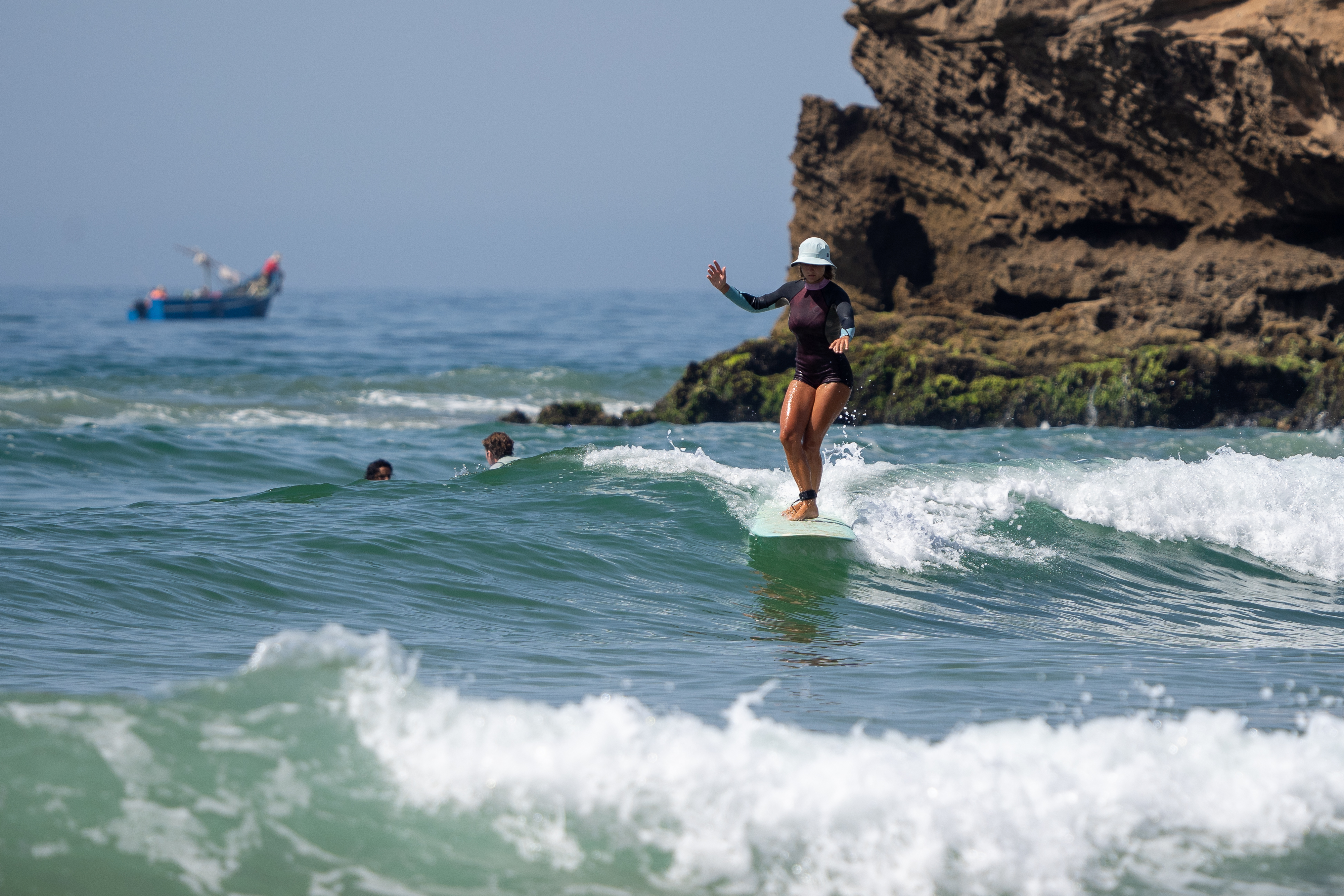 Beginner surfer catching first wave
